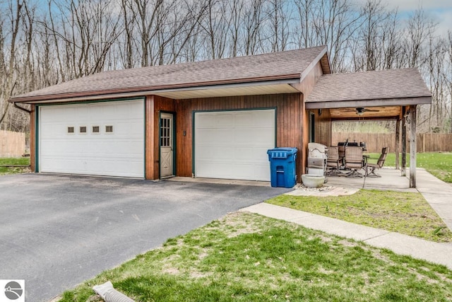 7726 Anway Dr, Battle Creek, MI 49014 - garage featuring fence and driveway