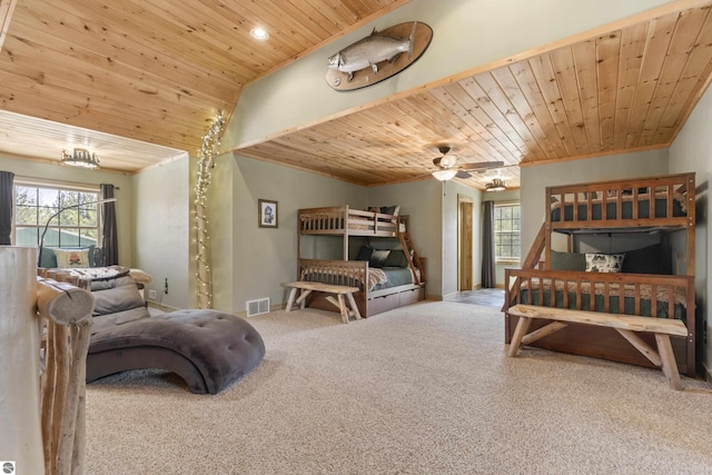 carpeted bedroom featuring visible vents, crown molding, wood ceiling, and multiple windows