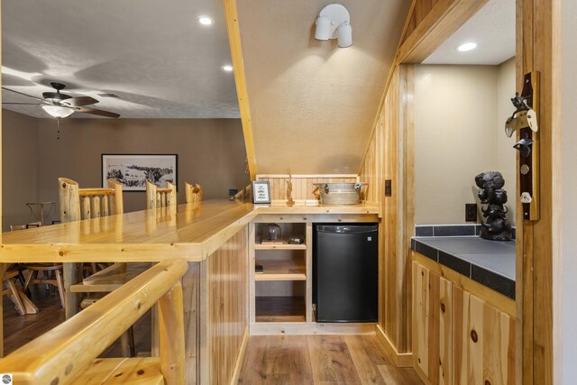 wine area featuring recessed lighting, light wood-style floors, and a ceiling fan