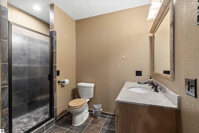 full bath featuring tile patterned flooring, toilet, vanity, and a stall shower