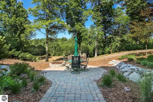 view of patio / terrace featuring a fire pit