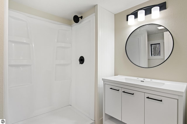 2823 E Ironwood Dr, Traverse City, MI 48685 - full bathroom with vanity and a stall shower