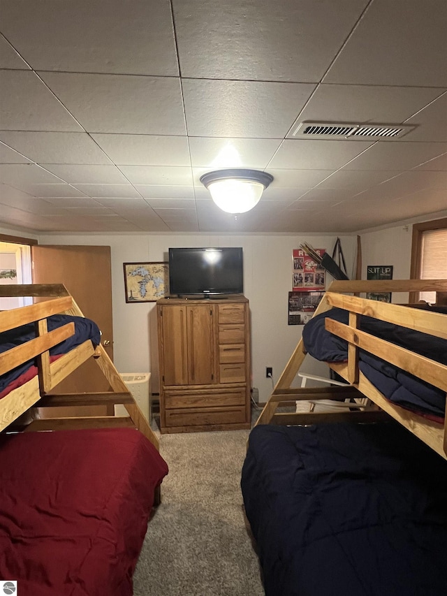 carpeted bedroom with visible vents