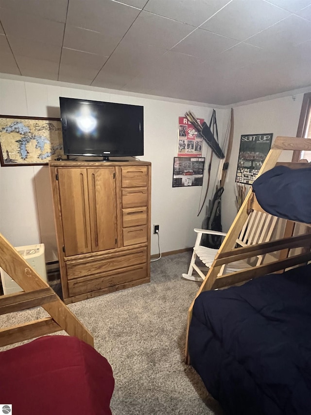 bedroom with baseboards and carpet floors