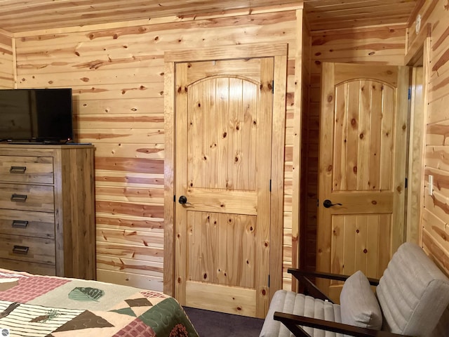 bedroom with wood walls