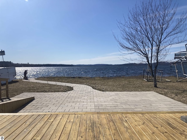 exterior space with a water view and a patio area