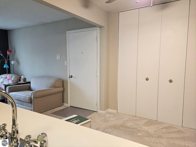 100 Fourth Ave Unit E-3, Tawas City, MI 48763 - interior space featuring carpet flooring and a ceiling fan