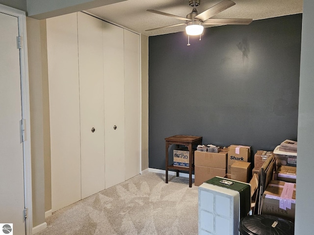 100 Fourth Ave Unit E-3, Tawas City, MI 48763 - interior space with ceiling fan, carpet flooring, and a closet