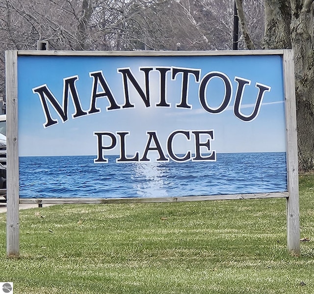100 Fourth Ave Unit E-3, Tawas City, MI 48763 - community sign featuring a water view and a yard