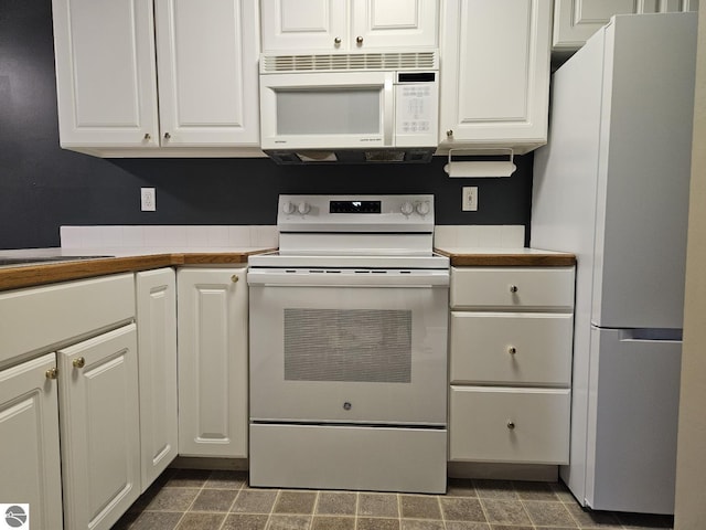 100 Fourth Ave Unit E-3, Tawas City, MI 48763 - kitchen featuring light countertops, a sink, white cabinetry, and white appliances