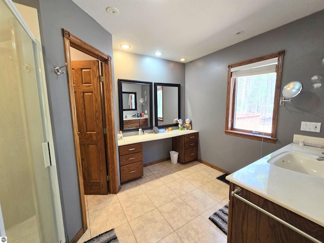 bathroom featuring baseboards, recessed lighting, tile patterned flooring, a shower stall, and vanity