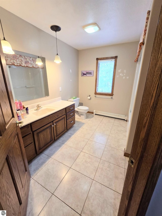 full bathroom featuring a baseboard heating unit, tile patterned flooring, toilet, and vanity