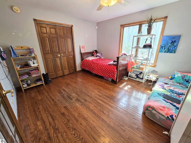 bedroom featuring wood finished floors, a closet, and ceiling fan