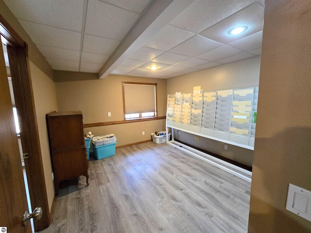 unfurnished room with recessed lighting, wood finished floors, and baseboards