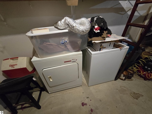 clothes washing area featuring washing machine and dryer and laundry area