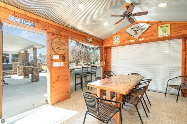 3901 W Thendara Dr, Gladwin, MI 48624 - dining area featuring recessed lighting, wooden walls, vaulted ceiling, and ceiling fan