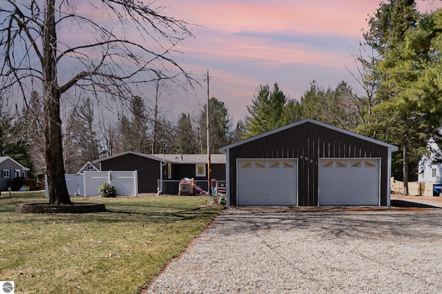 3901 W Thendara Dr, Gladwin, MI 48624 - single story home with a garage, a front yard, and fence