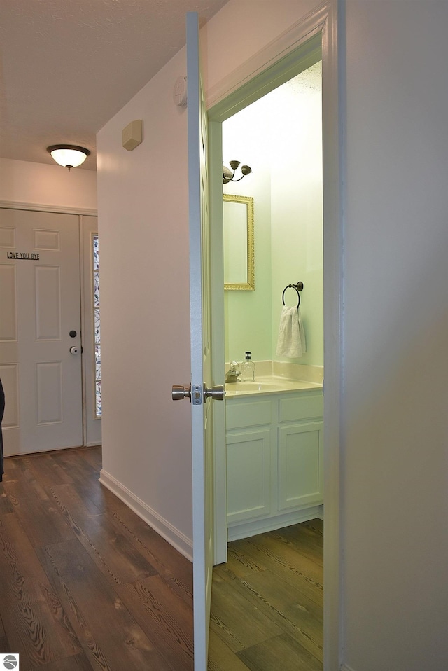 interior space with baseboards and dark wood finished floors