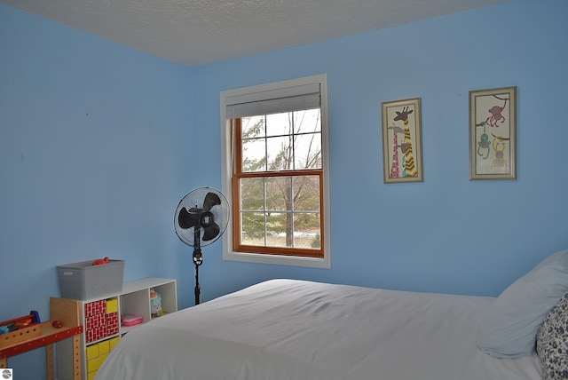 bedroom featuring a textured ceiling