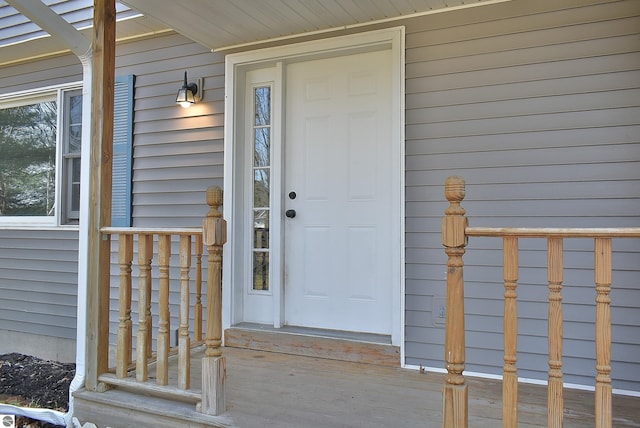doorway to property with a porch
