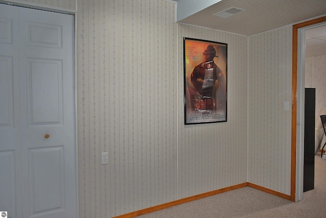 interior space with visible vents and carpet flooring