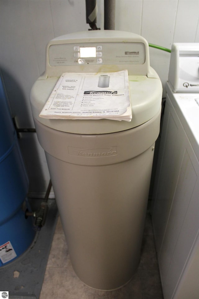 room details with washing machine and clothes dryer