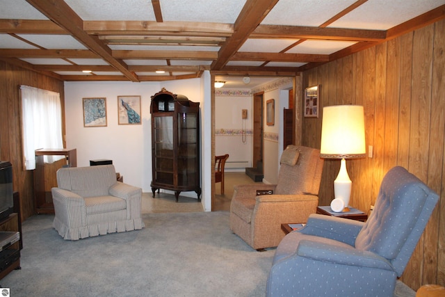 living room featuring wood walls, beam ceiling, and coffered ceiling