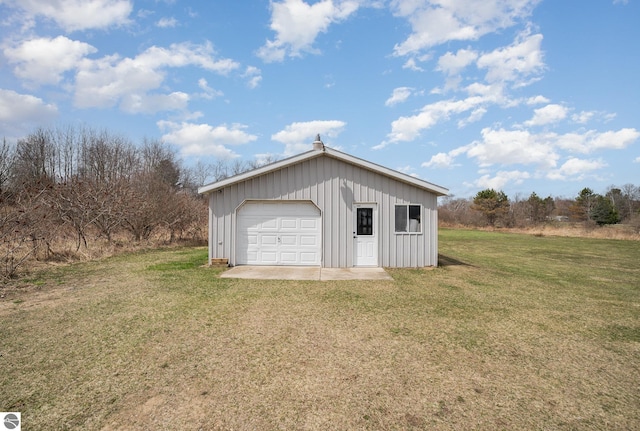 detached garage featuring driveway
