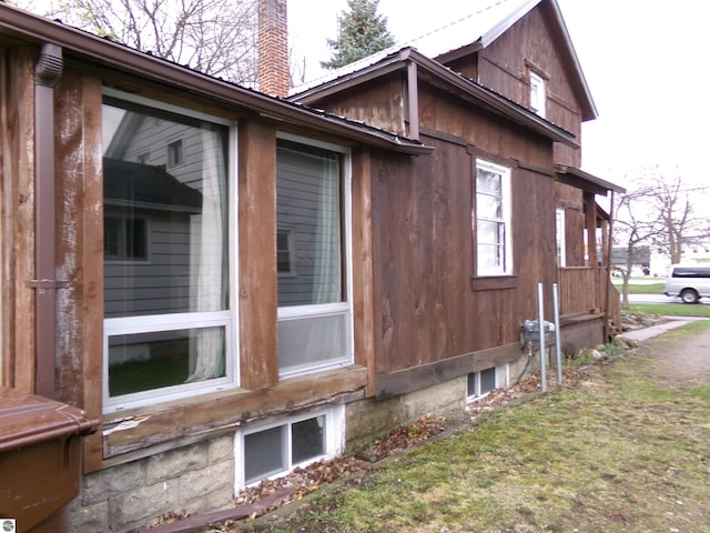 116 N Main St, Saint Louis, MI 48880 - view of home's exterior with a chimney