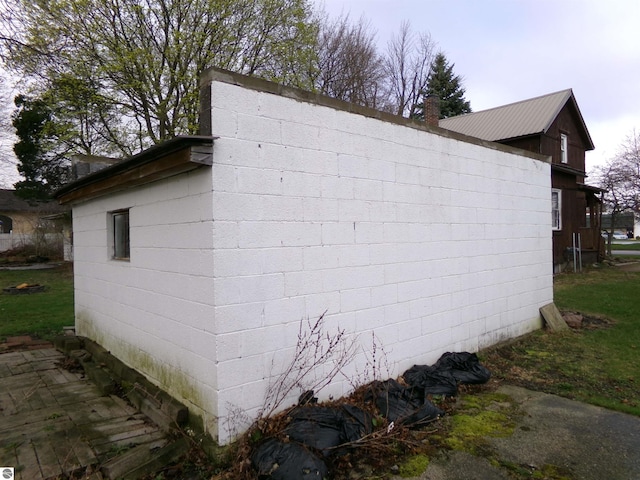116 N Main St, Saint Louis, MI 48880 - view of home's exterior featuring concrete block siding