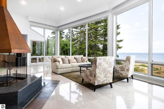 5343 Michibay Dr, Manistique, MI 49854 - sunroom with recessed lighting, plenty of natural light, and a water view