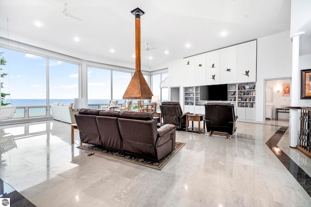 5343 Michibay Dr, Manistique, MI 49854 - living room with ceiling fan, marble finish floor, and a water view