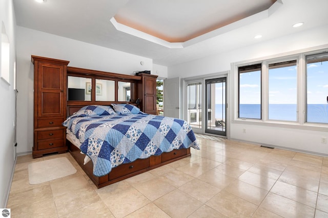 5343 Michibay Dr, Manistique, MI 49854 - bedroom featuring recessed lighting, a tray ceiling, light tile patterned floors, baseboards, and access to outside