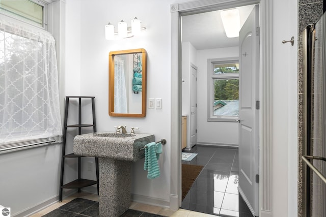 5343 Michibay Dr, Manistique, MI 49854 - bathroom featuring baseboards and tile patterned flooring