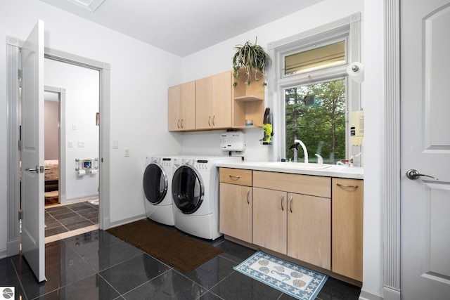 5343 Michibay Dr, Manistique, MI 49854 - washroom featuring washing machine and clothes dryer, a sink, granite finish floor, cabinet space, and baseboards