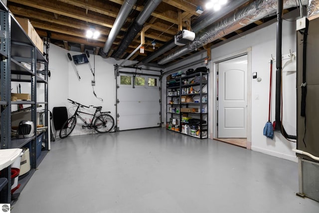 5343 Michibay Dr, Manistique, MI 49854 - garage with a garage door opener and baseboards