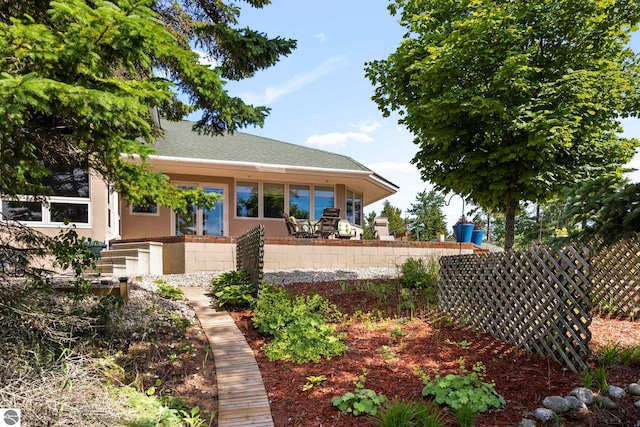 5343 Michibay Dr, Manistique, MI 49854 - view of front of house featuring roof with shingles