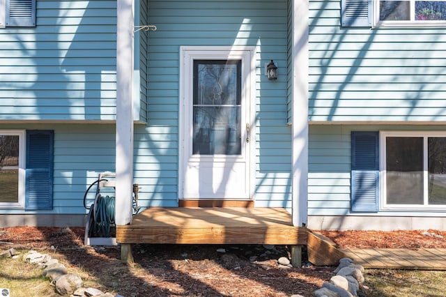 1294 Fisher Rd, Traverse City, MI 49685 - view of exterior entry featuring a deck