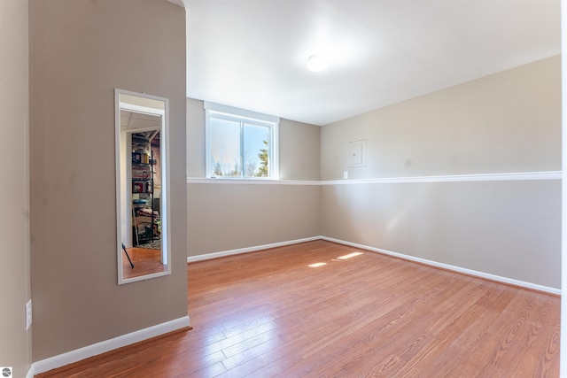 1294 Fisher Rd, Traverse City, MI 49685 - spare room featuring baseboards and wood finished floors