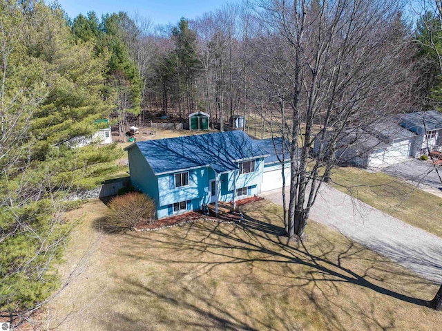 1294 Fisher Rd, Traverse City, MI 49685 - view of front of house featuring a wooded view