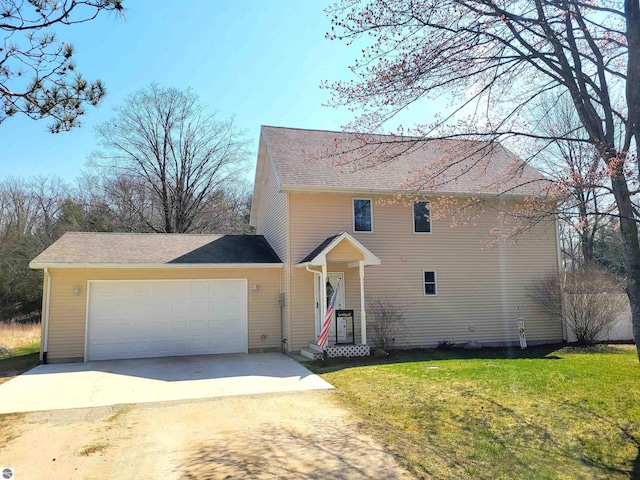 734 N Rolland Rd, Lake Isabella, MI 48893 - traditional-style house featuring concrete driveway, a garage, and a front yard