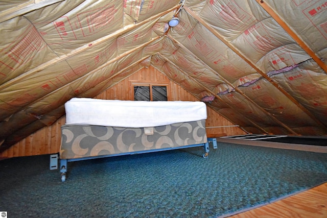 8991 W Oak Ln, Lake City, MI 49651 - bedroom featuring lofted ceiling and wood walls