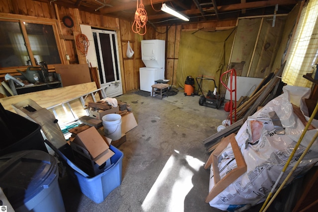 8991 W Oak Ln, Lake City, MI 49651 - basement with stacked washing machine and dryer and wooden walls
