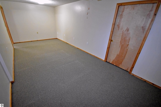 8991 W Oak Ln, Lake City, MI 49651 - finished basement with carpet flooring and baseboards