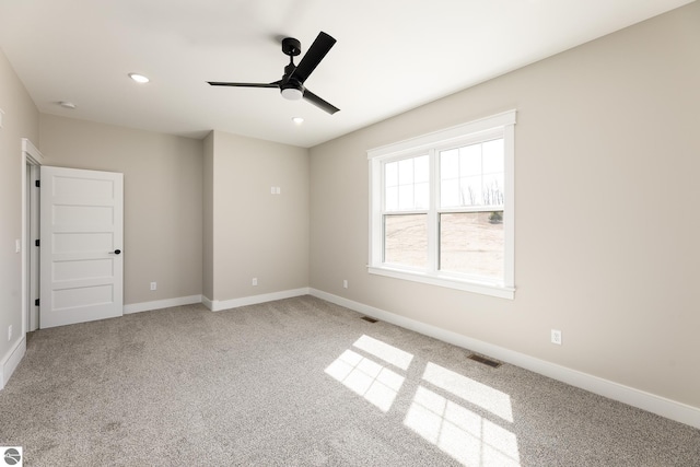 unfurnished room featuring recessed lighting, visible vents, a ceiling fan, carpet floors, and baseboards