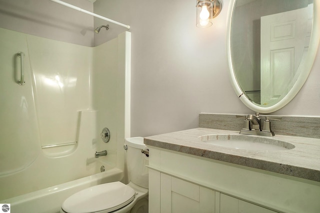 bathroom featuring shower / washtub combination, toilet, and vanity