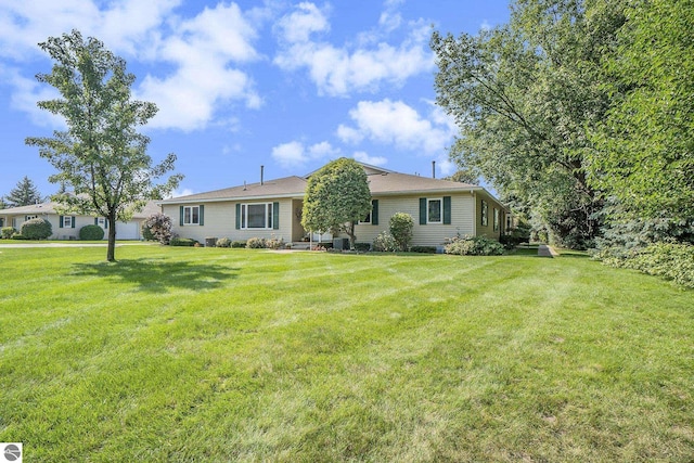 view of front of house with a garage and a front yard