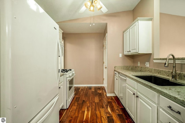 kitchen with a sink, dark wood finished floors, white appliances, light stone counters, and ceiling fan