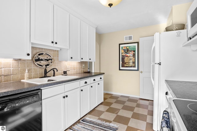 kitchen featuring light floors, visible vents, a sink, white appliances, and decorative backsplash