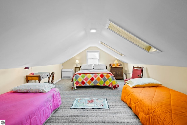 carpeted bedroom featuring lofted ceiling with skylight